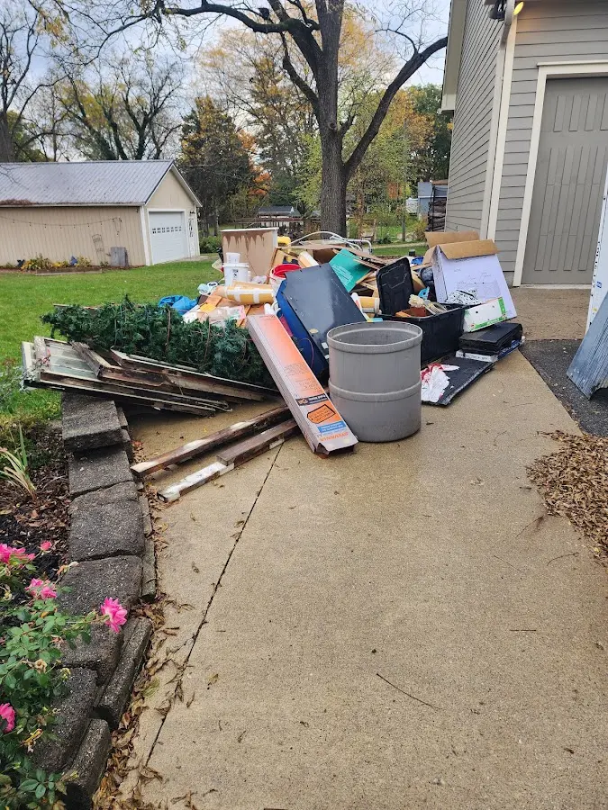 Dumpster being loaded with debris for 30 Yard Dumpster Rental in Austin